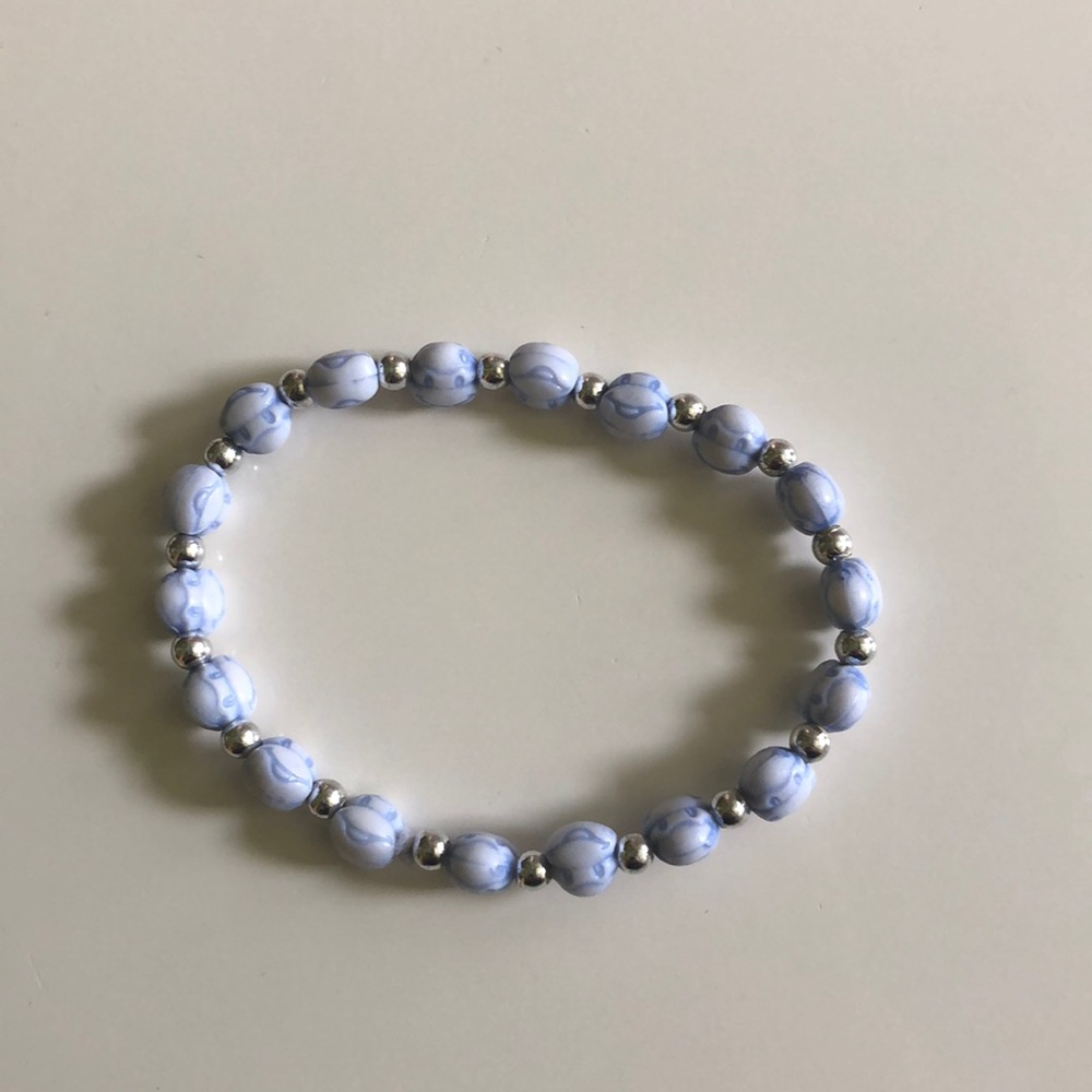 Blue monkey bracelet.